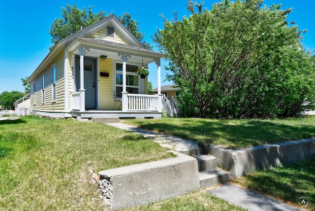 820 11th Ave, Helena, MT 59601 - shotgun-style home featuring covered porch and a front yard