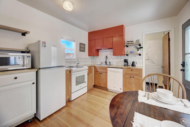 820 11th Ave, Helena, MT 59601 - kitchen with white appliances, open shelves, light wood-style floors, and backsplash