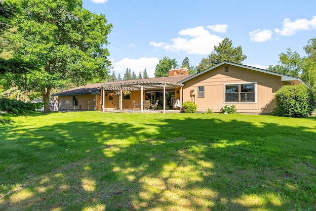 1229 Old Orchard Rd, Missoula, MT 59802 - back of house featuring a pergola, a chimney, a lawn, and a patio