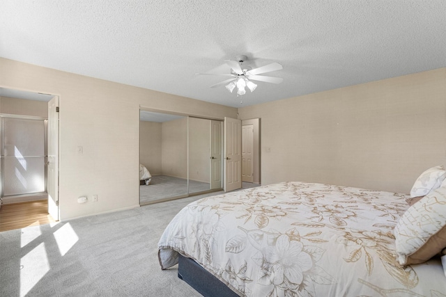 1229 Old Orchard Rd, Missoula, MT 59802 - carpeted bedroom with a closet, a ceiling fan, and a textured ceiling