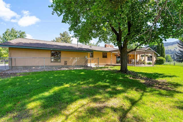1229 Old Orchard Rd, Missoula, MT 59802 - rear view of property with a patio, a chimney, and a mountain view