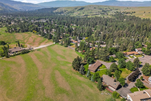 1229 Old Orchard Rd, Missoula, MT 59802 - aerial view of property and surrounding area with a mountain backdrop and a forest
