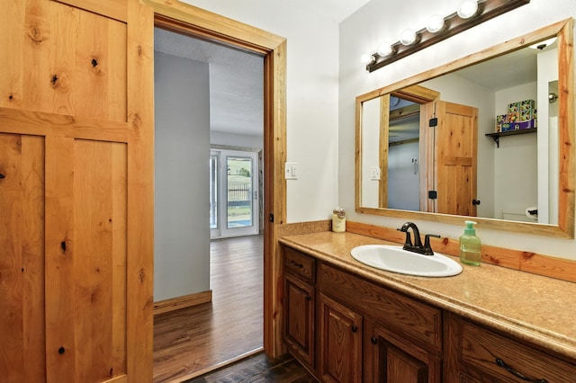 3121 6th Ave S, Great Falls, MT 59405 - bathroom with vanity and wood finished floors
