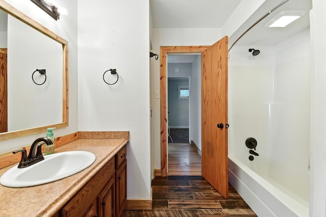 3121 6th Ave S, Great Falls, MT 59405 - bathroom with vanity, wood finished floors, and bathing tub / shower combination