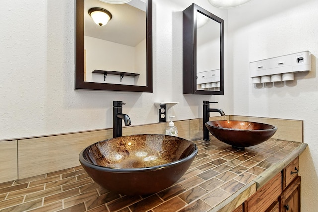 3121 6th Ave S, Great Falls, MT 59405 - bathroom with double vanity and a textured wall