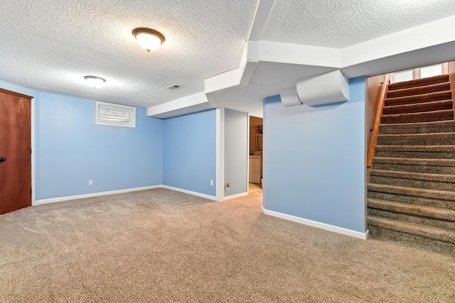 3121 6th Ave S, Great Falls, MT 59405 - below grade area featuring a textured ceiling, carpet floors, and stairway