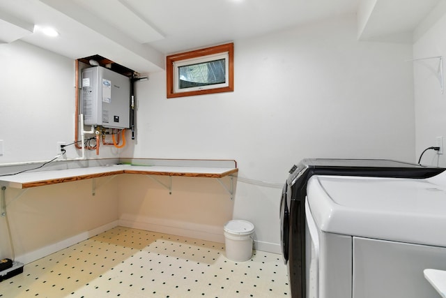 3121 6th Ave S, Great Falls, MT 59405 - washroom with water heater, washer / clothes dryer, and light flooring