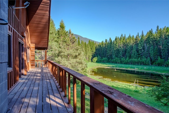 1429 Schoolhouse Lake Rd, Troy, MT 59935 - wooden deck with a wooded view and a water and mountain view