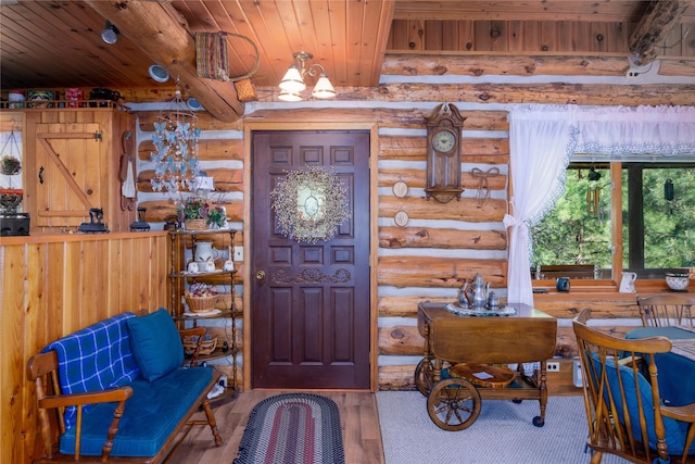 1429 Schoolhouse Lake Rd, Troy, MT 59935 - foyer entrance featuring rustic walls, a wood ceiling with exposed beams, wood finished floors, and a chandelier