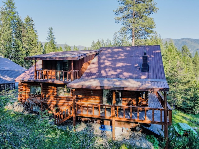 1429 Schoolhouse Lake Rd, Troy, MT 59935 - back of house featuring a metal roof and a deck with mountain view
