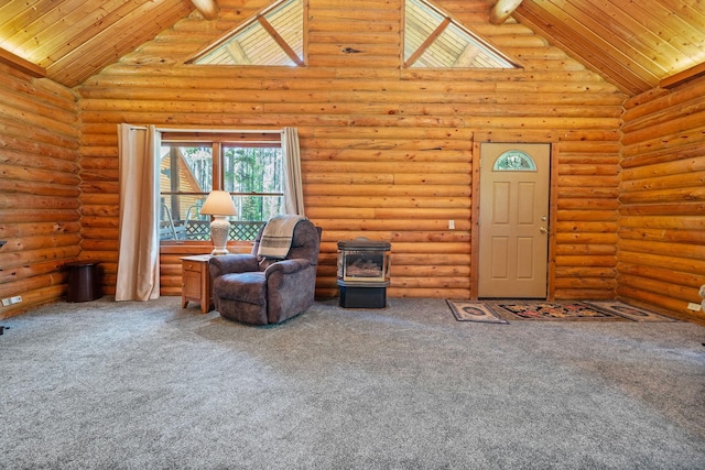 72 Giefer Creek Rd, Essex, MT 59916 - living area featuring rustic walls, wood ceiling, carpet, a wood stove, and high vaulted ceiling