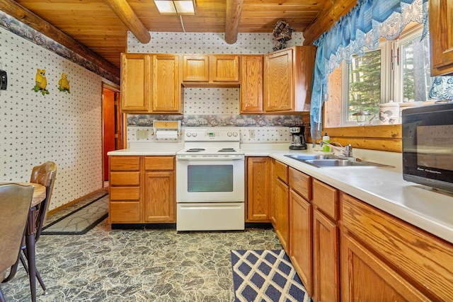 72 Giefer Creek Rd, Essex, MT 59916 - kitchen featuring electric stove, a wooden ceiling with exposed beams, stone finish floors, and light countertops