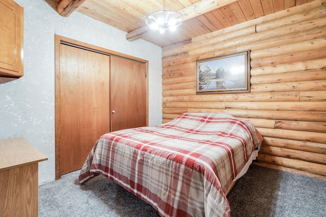 72 Giefer Creek Rd, Essex, MT 59916 - carpeted bedroom with rustic walls, wooden ceiling, and a closet