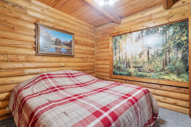72 Giefer Creek Rd, Essex, MT 59916 - bedroom with rustic walls, carpet floors, and a wooden ceiling with exposed beams