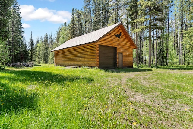 72 Giefer Creek Rd, Essex, MT 59916 - detached garage featuring a wooded view