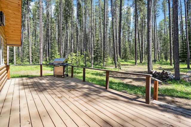 72 Giefer Creek Rd, Essex, MT 59916 - wooden terrace with a grill and a forest view