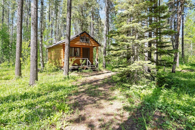 72 Giefer Creek Rd, Essex, MT 59916 - view of outbuilding with covered porch and a forest view