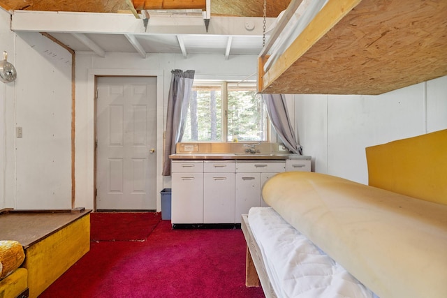 72 Giefer Creek Rd, Essex, MT 59916 - bedroom featuring dark colored carpet and beam ceiling