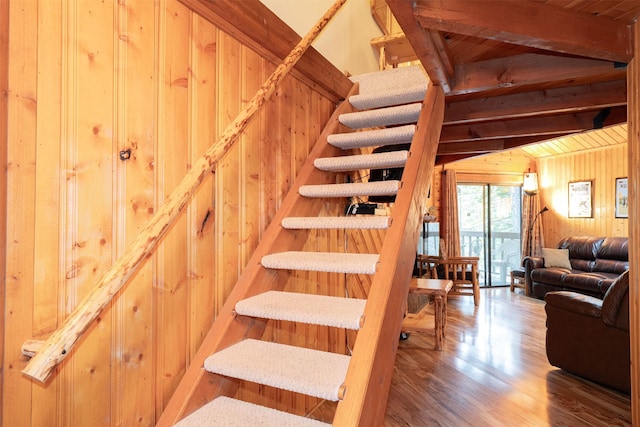 24 Alder Way Unit 3B, Whitefish, MT 59937 - stairway featuring wood walls, wood ceiling, and wood finished floors