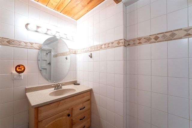 24 Alder Way Unit 3B, Whitefish, MT 59937 - bathroom featuring tile walls and vanity