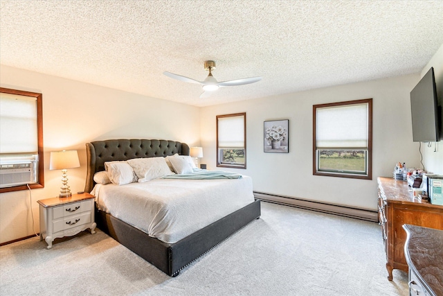 3446 Tizer Dr, Helena, MT 59602 - bedroom featuring a baseboard radiator, light carpet, ceiling fan, and a textured ceiling