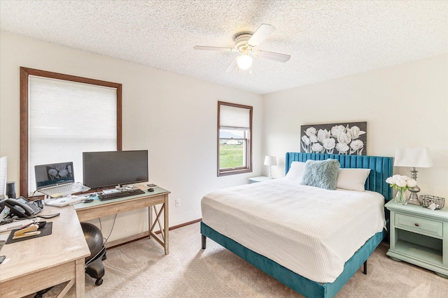 3446 Tizer Dr, Helena, MT 59602 - bedroom featuring light colored carpet, a desk, a textured ceiling, and ceiling fan