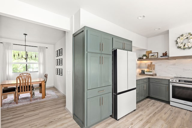 223 12th St N, Great Falls, MT 59401 - kitchen featuring freestanding refrigerator, stainless steel electric range, a chandelier, light wood-style floors, and recessed lighting