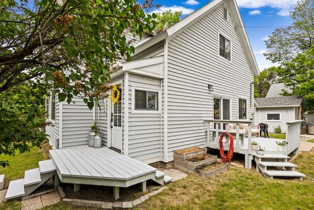 223 12th St N, Great Falls, MT 59401 - rear view of house with a wooden deck and a lawn