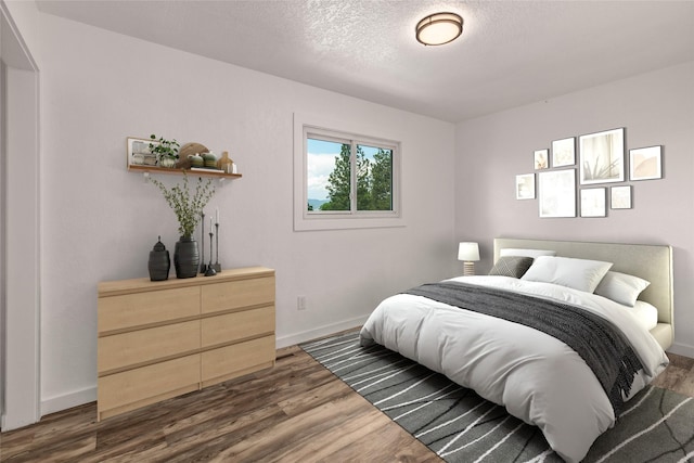 2424 55th St, Missoula, MT 59803 - bedroom with dark wood finished floors and a textured ceiling