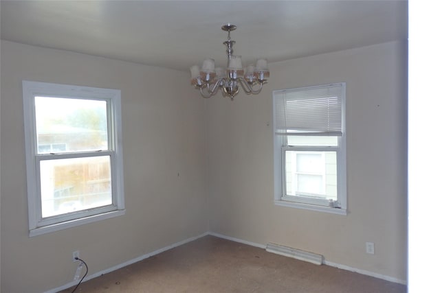 17 Crane Ave, Stockett, MT 59480 - empty room featuring a chandelier, plenty of natural light, and carpet