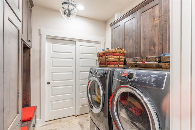 128 Antler Peak Ln, Kalispell, MT 59901 - laundry area featuring separate washer and dryer and cabinet space
