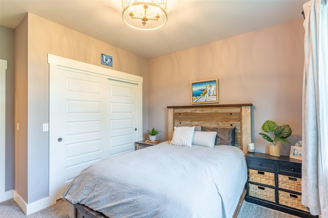 128 Antler Peak Ln, Kalispell, MT 59901 - carpeted bedroom featuring a chandelier and a closet