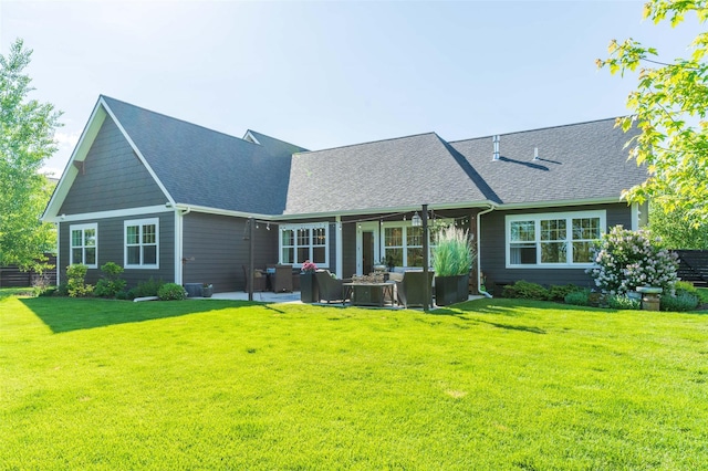 128 Antler Peak Ln, Kalispell, MT 59901 - rear view of house with an outdoor hangout area, a shingled roof, and a yard