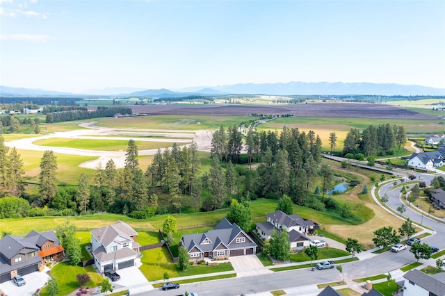 128 Antler Peak Ln, Kalispell, MT 59901 - aerial perspective of suburban area featuring mountains