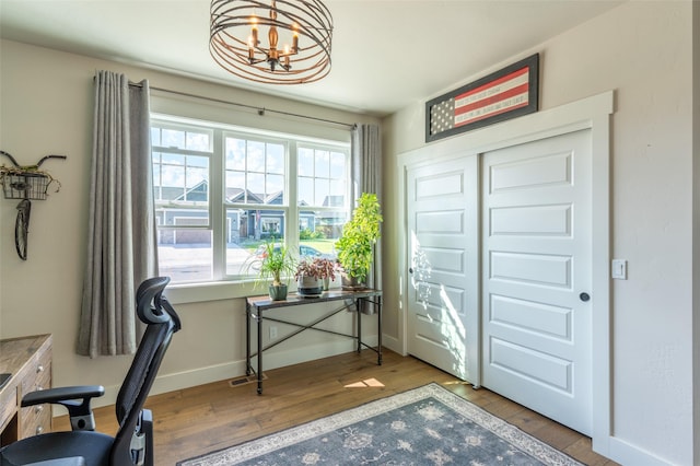128 Antler Peak Ln, Kalispell, MT 59901 - office featuring wood finished floors and a chandelier