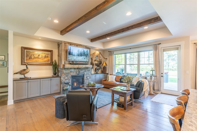 128 Antler Peak Ln, Kalispell, MT 59901 - living area featuring light wood-style flooring, a fireplace, beamed ceiling, and recessed lighting