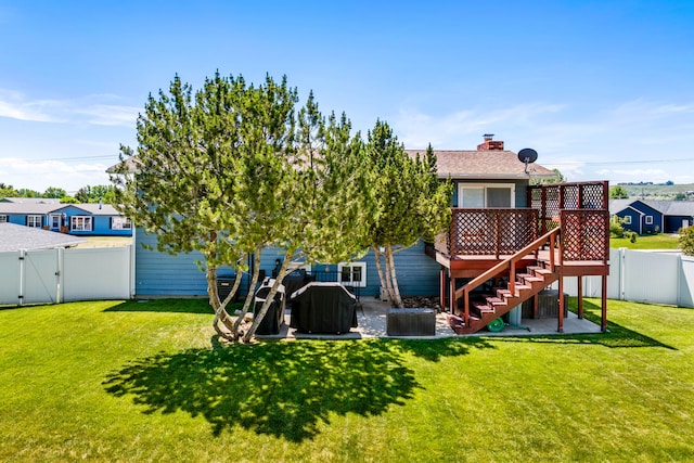 1237 Park Garden Rd, Great Falls, MT 59404 - back of property with a fenced backyard, a gate, stairway, a deck, and a chimney