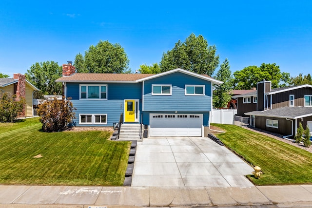 1237 Park Garden Rd, Great Falls, MT 59404 - raised ranch featuring concrete driveway, an attached garage, and a chimney