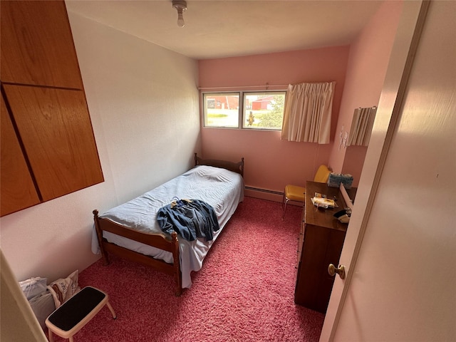 521 N Central Ave, Ekalaka, MT 59324 - bedroom featuring carpet floors and a baseboard radiator