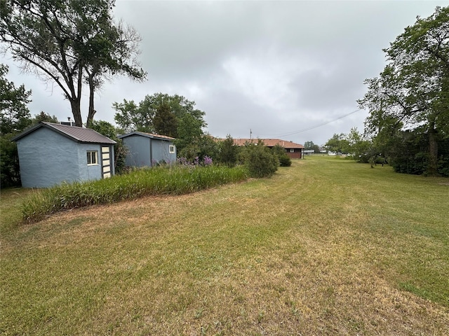 521 N Central Ave, Ekalaka, MT 59324 - view of green lawn featuring an outbuilding