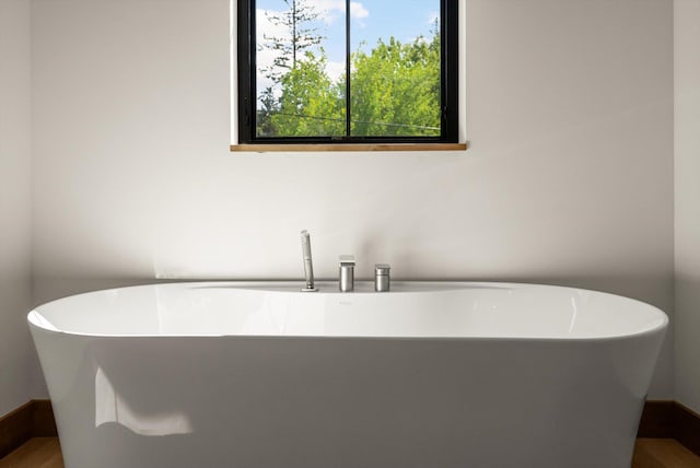 508 Dakota Ave, Whitefish, MT 59937 - full bath with a freestanding tub and wood finished floors