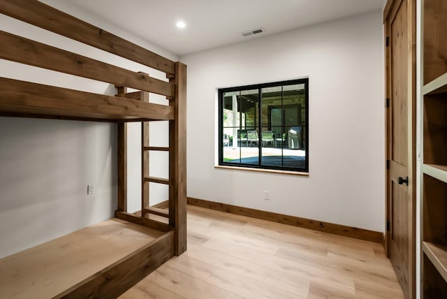 508 Dakota Ave, Whitefish, MT 59937 - unfurnished bedroom with light wood finished floors and recessed lighting