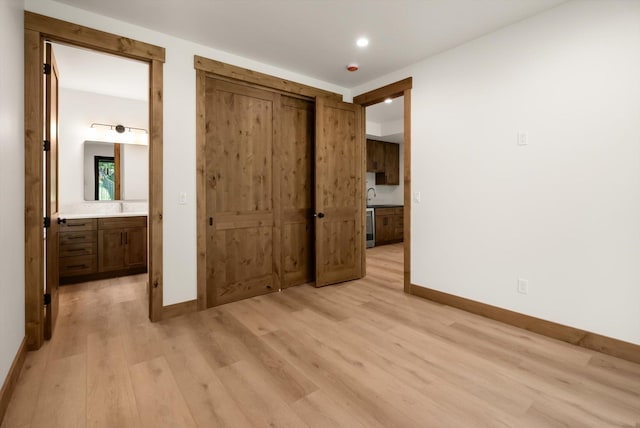 508 Dakota Ave, Whitefish, MT 59937 - unfurnished bedroom with light wood-style floors, ensuite bath, recessed lighting, and a closet