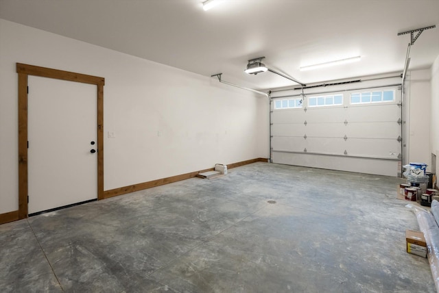 508 Dakota Ave, Whitefish, MT 59937 - garage featuring a garage door opener and baseboards