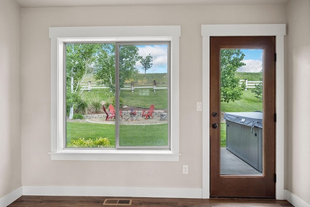 150 Swede Trl, Kalispell, MT 59901 - doorway to outside with healthy amount of natural light and wood finished floors