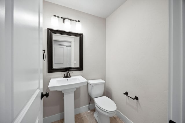 150 Swede Trl, Kalispell, MT 59901 - bathroom with toilet and baseboards