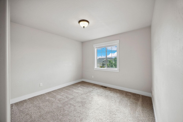 150 Swede Trl, Kalispell, MT 59901 - carpeted spare room with baseboards
