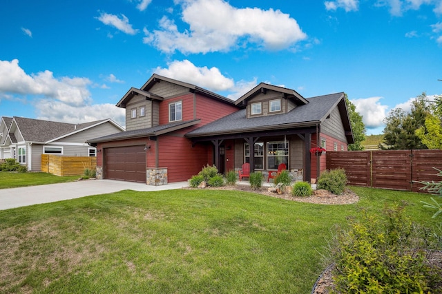150 Swede Trl, Kalispell, MT 59901 - craftsman-style house featuring stone siding, concrete driveway, a porch, an attached garage, and a shingled roof