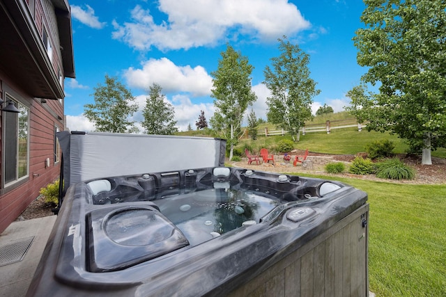 150 Swede Trl, Kalispell, MT 59901 - view of patio / terrace featuring a hot tub