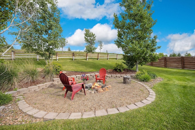 150 Swede Trl, Kalispell, MT 59901 - fenced backyard with an outdoor fire pit